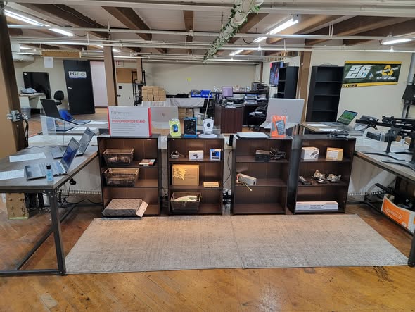 Shelves and display counters with laptops and electronics