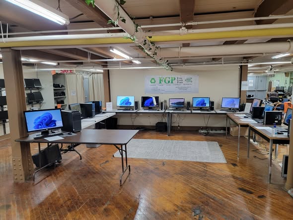 Desktop computers displayed around the shop floor
